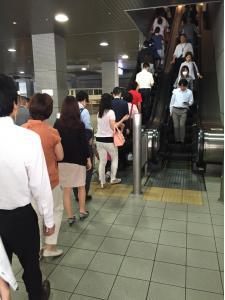 Queuing to get inside Shinagawa train station