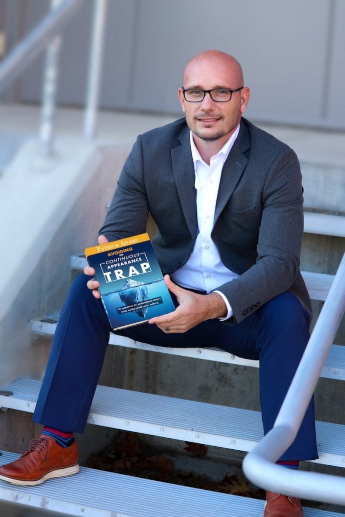 Patrick Adams with His Book