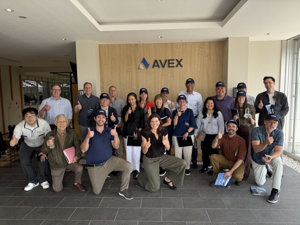 Leadership cohort learning about precision manufacturing and continuous improvement at Avex in Japan.